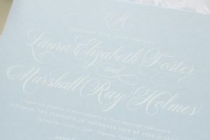 white and dusty blue invitations