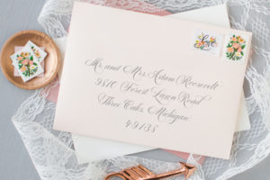 blush envelope with calligraphy script