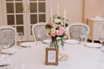 wedding reception table numbers with pink stripes