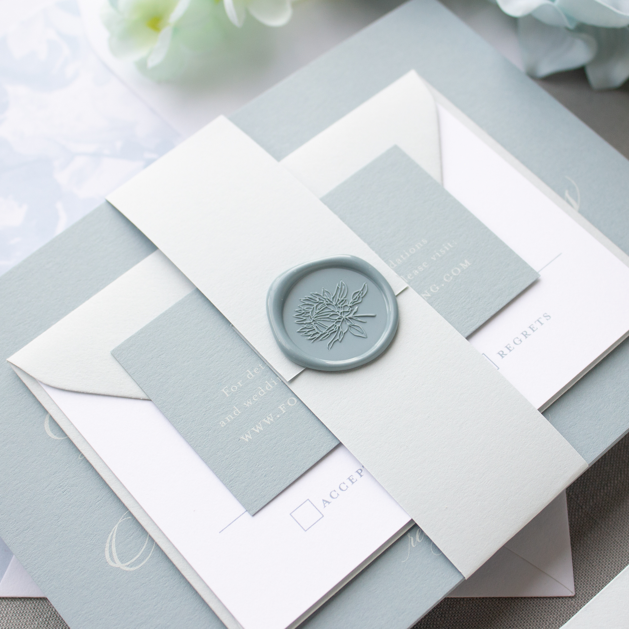 dusty blue wax seal wedding invitation