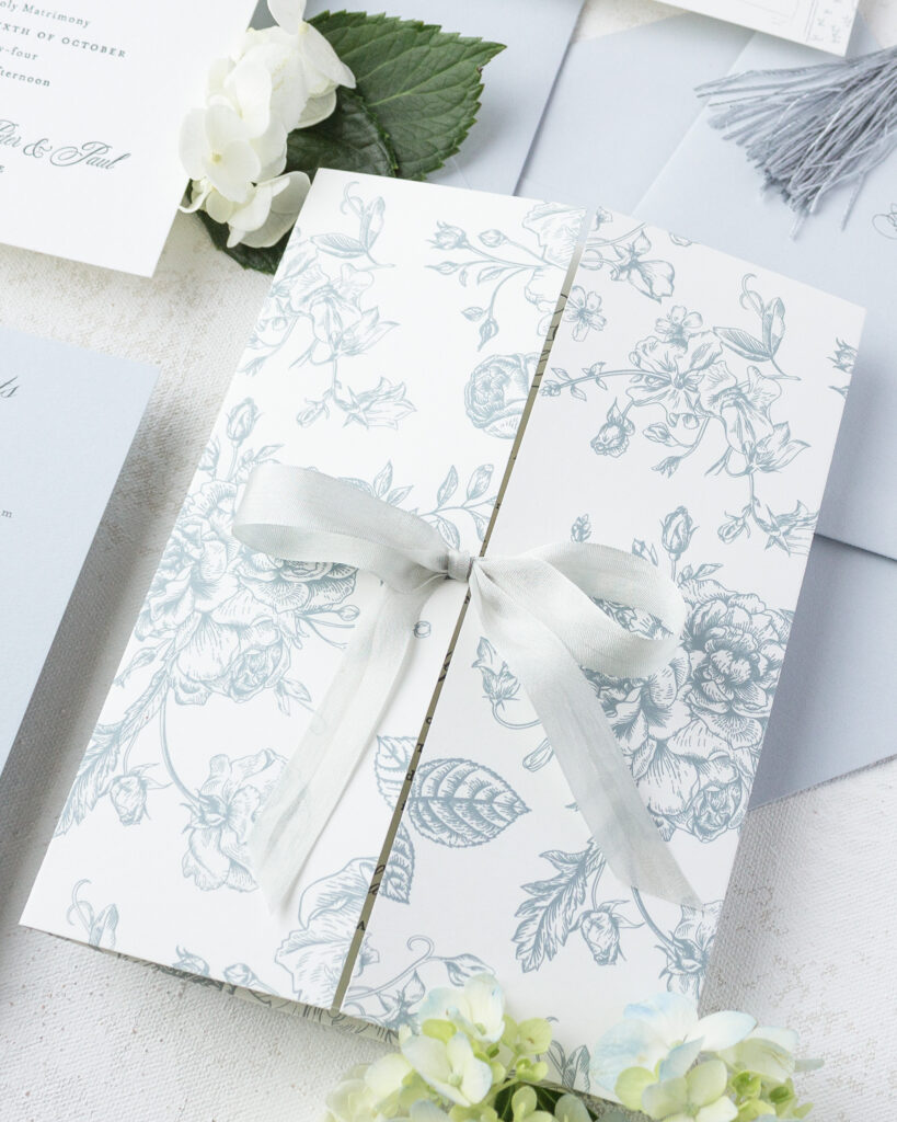 gatefold with ribbon tied in a bow