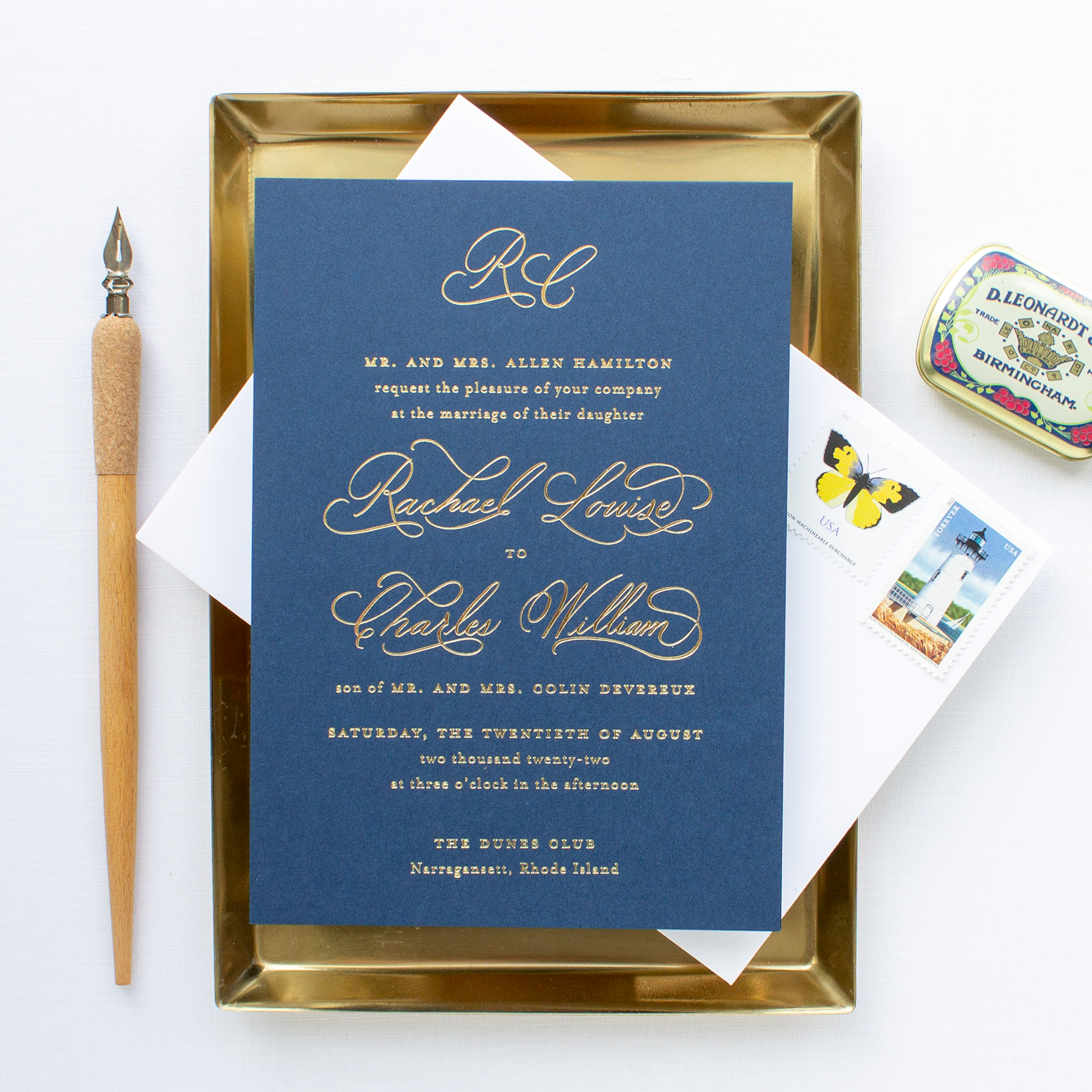 wedding invitations with gold foil on navy paper