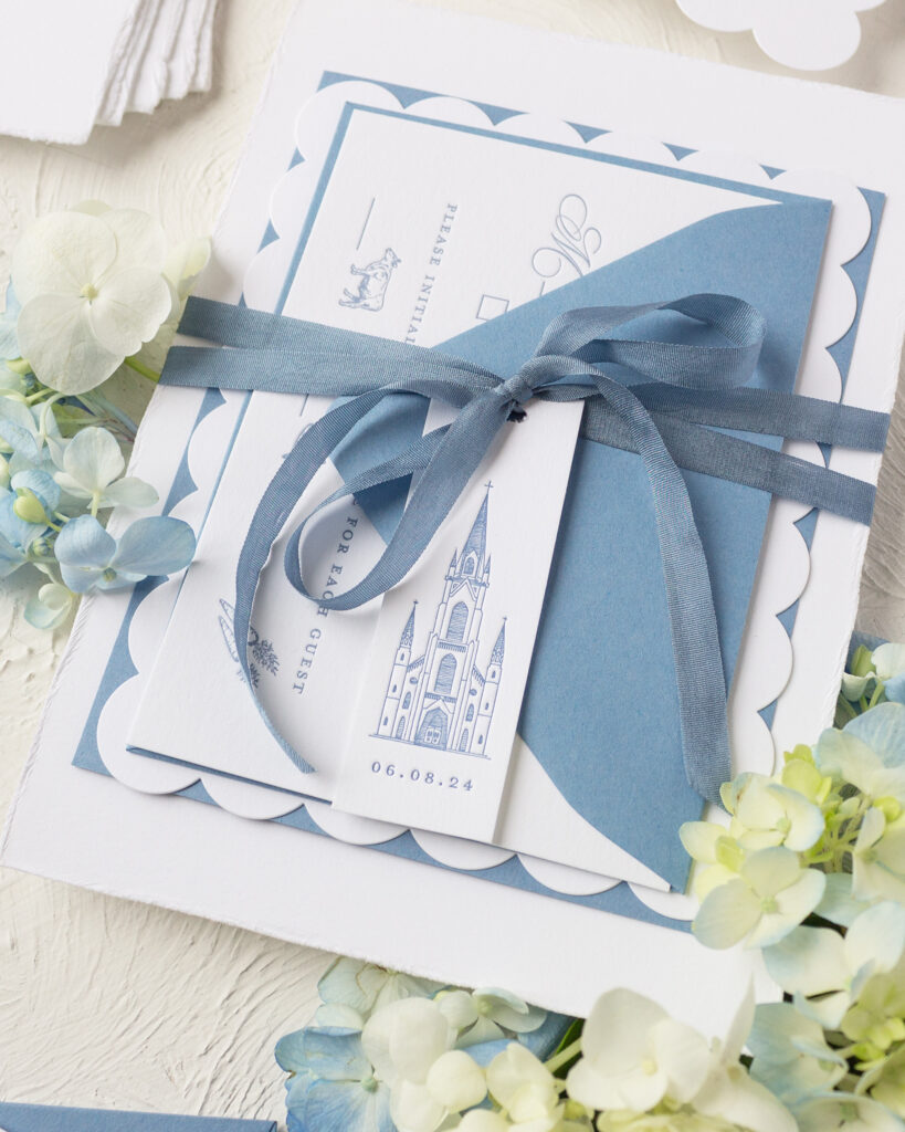 invitation tag with dusty blue ribbon