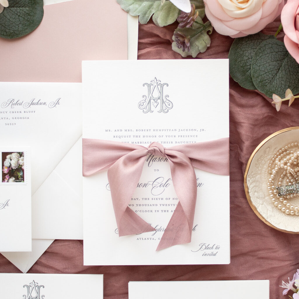 silk ribbon wedding invitations tied in a knot