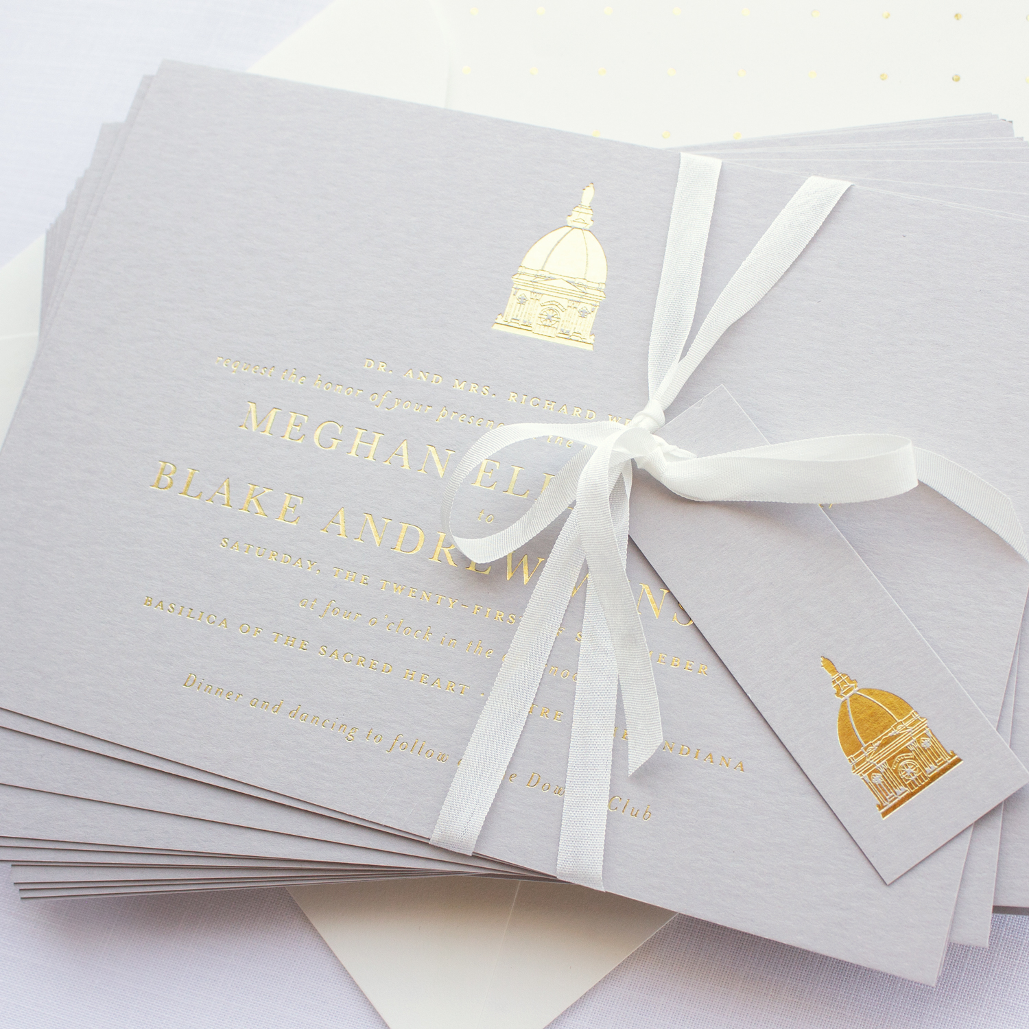 wedding invitation with gold foil on gray paper