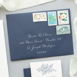 white ink on navy blue envelopes
