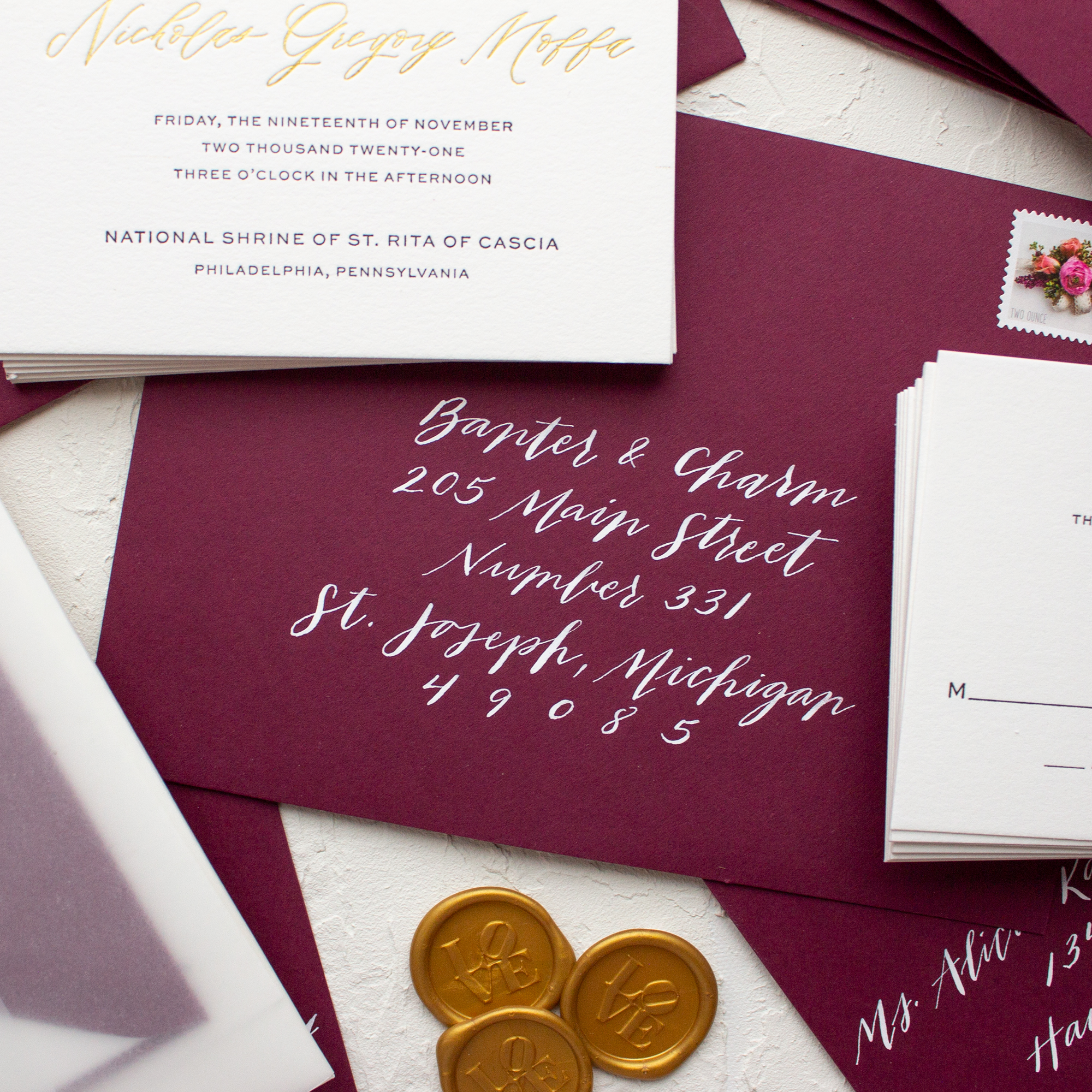 hand calligraphy white ink burgundy envelope